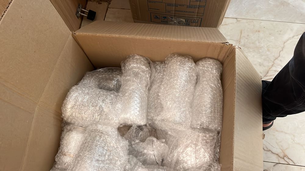 Glass items wrapped in bubble packaging by Viharsh Packers And Movers