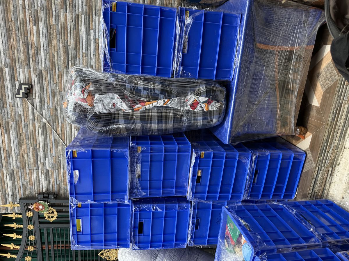 Reusable crates and protective sheets used for office moves